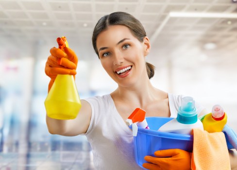Cleaner using approved products and protective equipment