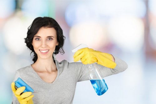 Technician wearing PPE while cleaning carpet in a home